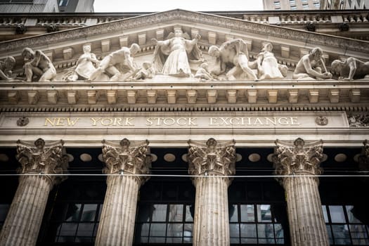 New York, USA - September 19, 2022: Bas-relief and inscription on the facade of the New York Stock
