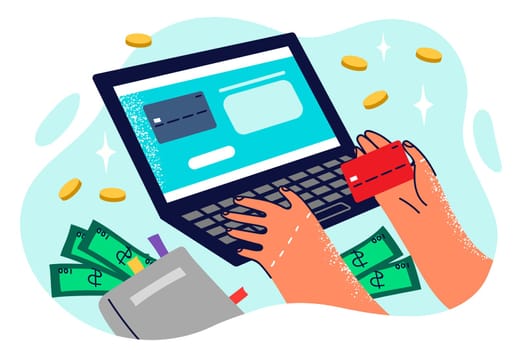 Hands of person doing online shopping through laptop entering credit card details to make payment