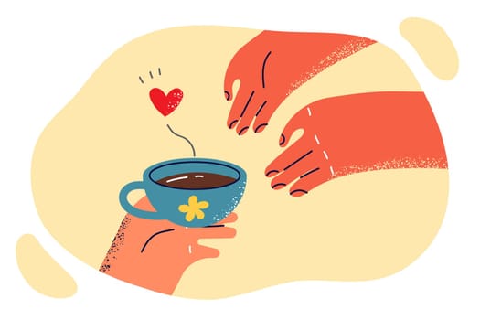 Hand passes freshly brewed coffee to another person for romantic courtship during love relationship