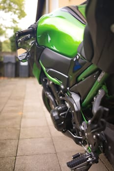 Close-up of the details of a toxic green motorcycle in Germany