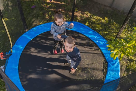 children jump on the trampoline