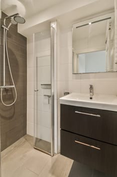 a small bathroom with a shower and a sink