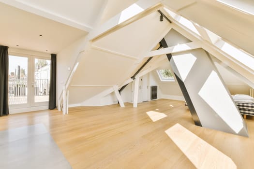 a large white room with a triangular play house in