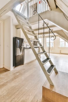 a staircase in a home with a kitchen and stairs