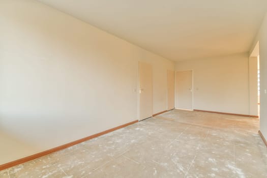 a empty room with a tile floor and white walls