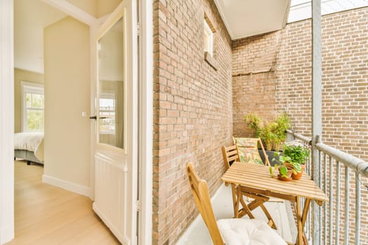 a dining room with a table and a brick wall