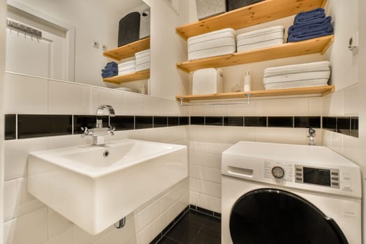 a bathroom with a sink and a washing machine