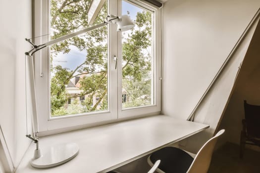 a desk in front of a window with a view