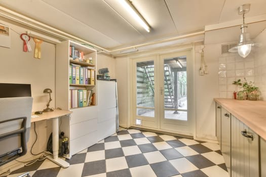 a kitchen with a checkered floor and a