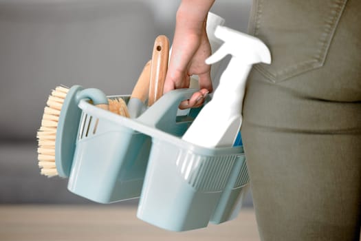 Cleaning tools, clean service and brush with hands holding basket with sponge and hygiene products. Mockup for ecofriendly detergent, domestic chores and cleaning service for janitor or maid working