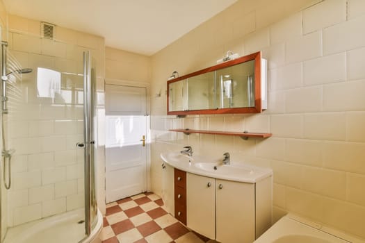 a bathroom with a shower sink and a mirror