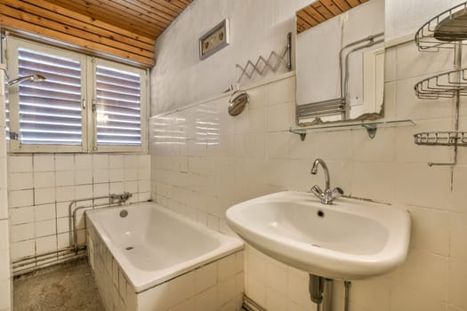 a bathroom with a sink and a bath tub