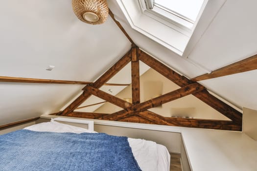 a bedroom with a bed and a ceiling with triangles