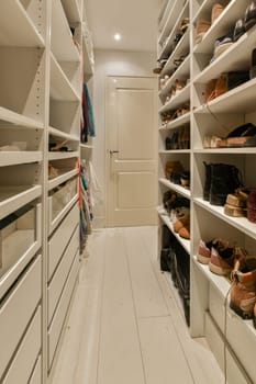 a large walk in closet filled with lots of shoes