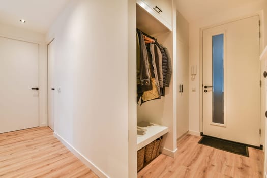 a walk in closet with a mirror and a door