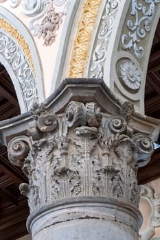The capital of an old column in the church. Vertical view
