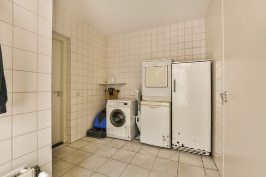 a kitchen with a washing machine and a refrigerator