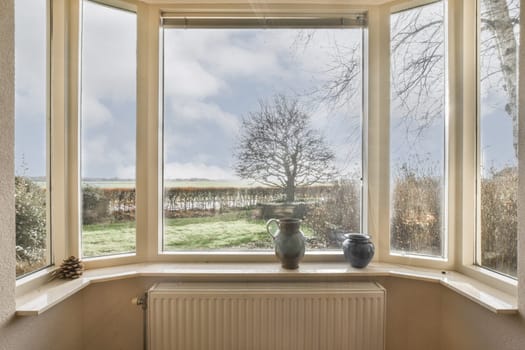 a view of the countryside from a window with a