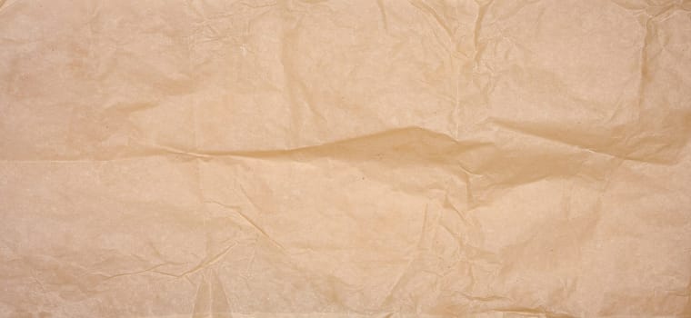 Crumpled brown parchment paper, close up