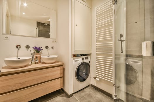 a bathroom with a sink and a washing machine
