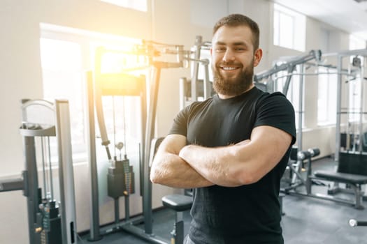 Portrait of smiling personal fitness trainer in gym