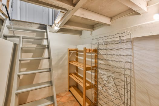 a set of stairs in a room with a ladder