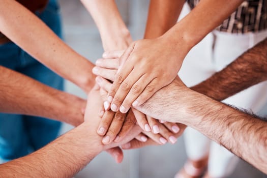 Top view, hands and together to connect, for support and solidarity and team building for success, agreement and being community. Hand gesture, group stack pile and connection for loyalty and unity.