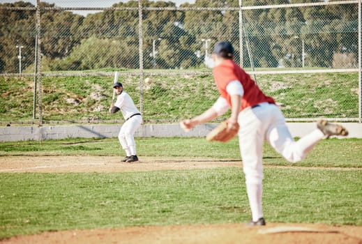 Baseball game, pitcher and man with bat on field for competition, sports and contest in summer. Outdoor sport games, men and softball for wellness, fitness or workout on grass for professional career.