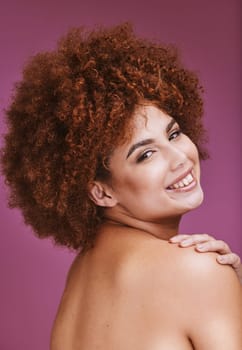 Happy woman, shoulder and afro hairstyle portrait in empowerment, curly maintenance or skincare salon. Smile, beauty model or natural hair texture on cosmetics studio or on isolated purple background