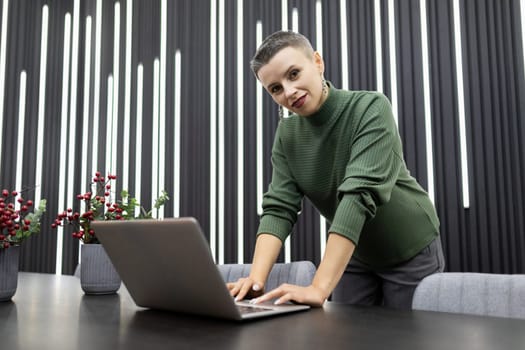 intelligent professional employee woman working on a project while sitting in the office