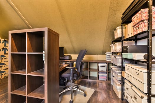 an office with a desk and a chair and shelves