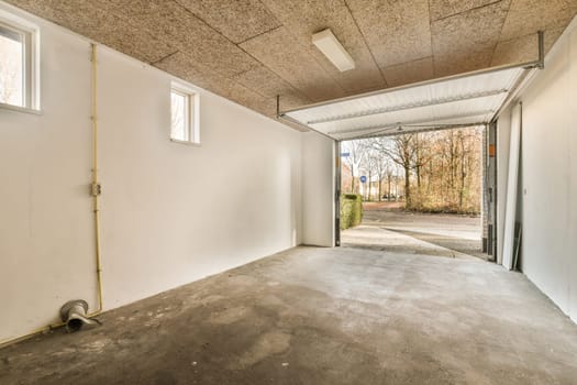 the interior of a building with a garage door open