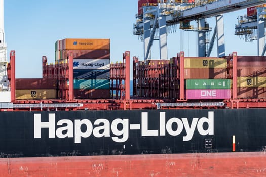 Montevideo, Uruguay - 5 February 2023: Containers being loaded onto Hapag Lloyd ship in commercial port