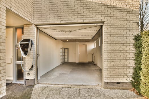 the entrance to a building with an open garage door