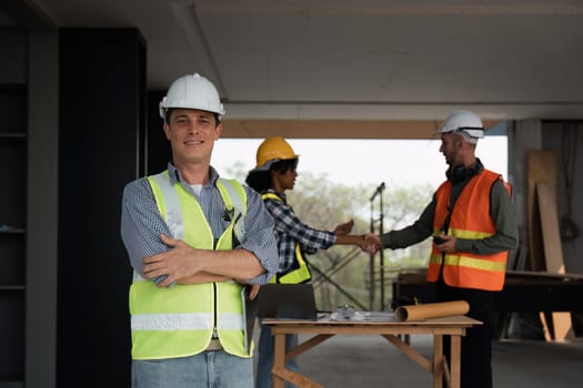 Portrait of a confident male engineer, builder and architecture at the construction site, Behind the engineer made an agreement