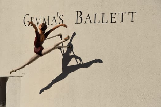 Gemma's Ballett - Figure of a floating ballet dancer reflecting on a house facade in Germany