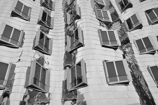 Mirrored metal facade of the Gehry buildings at the Media Harbour in Dusseldorf, Germany