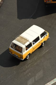 Closeup shot of a white and yellow bus on a road