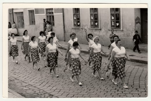 Vintage photo shows women prepare to Spartakiada. Spartakiada - a prezentation of health and prosperity of the socialist and communist regime.