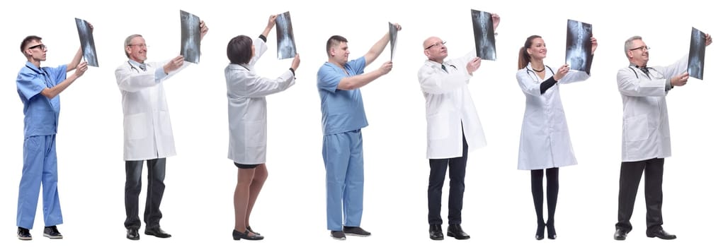 group of doctors holding x-ray isolated on white