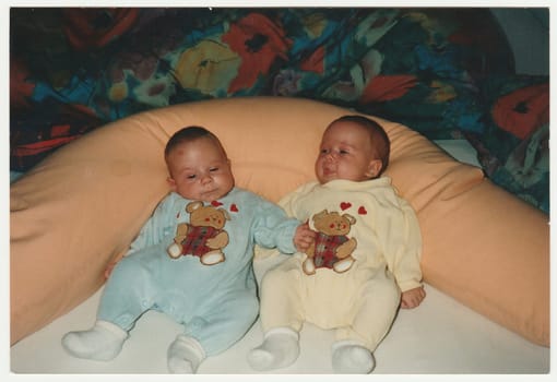 Vintage photo shows babies twins.