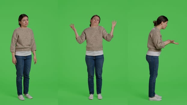 Upset frustrated woman acting angry on full body greenscreen