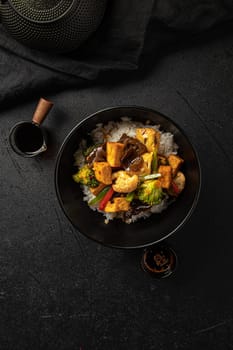 Vegetarian tofu bowl with vegetables and rice