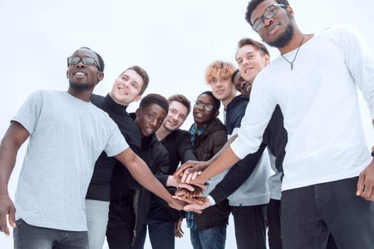 group of diverse young people showing their unity . isolated on a white background