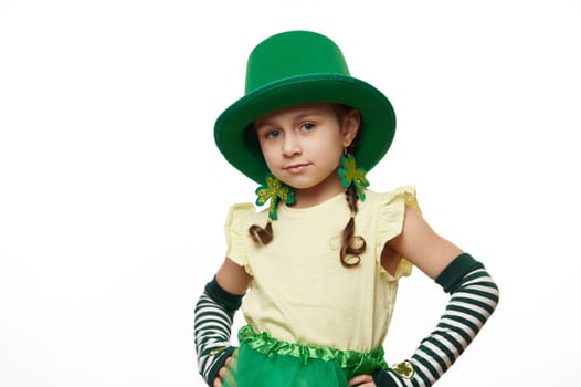 Lovely little child girl dressed as Leprechaun for Irish event - Saint Patrick's Day party, isolated on white background
