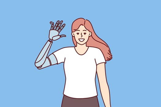 Happy girl waves prosthesis hand to demonstrate new mechanical robotic hand