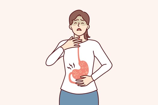 Sick woman with symptoms of gastroesophageal reflux or gastritis disease resulting from junk food