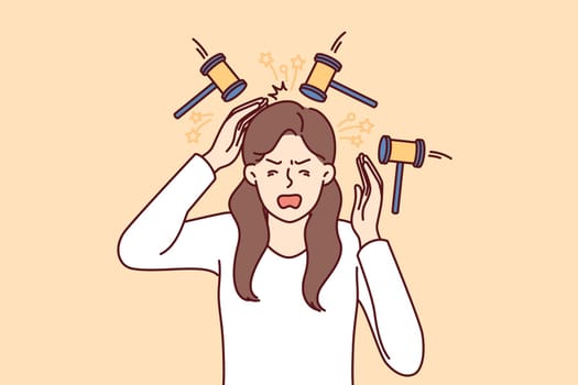 Upset woman experiencing headache standing among hammers symbolizing buzzing in ears