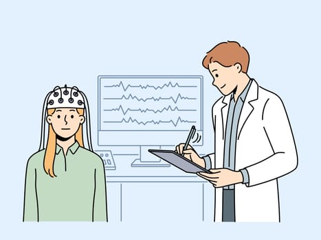 Female patient do EEG scan in clinic