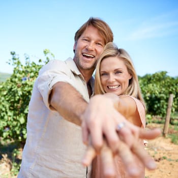Theyre a couple who knows how to have have fun. Portrait of a mature couple enjoying a day in the vineyards